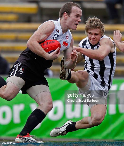 Stephen Clifton of North Ballarat runs with the ball during the round 11 VFL match between Collingwood and North Ballarat at Victoria Park on July 3,...