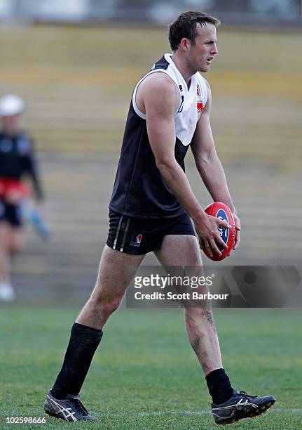 David Hale of North Ballarat prepares to kick the ball during the round 11 VFL match between Collingwood and North Ballarat at Victoria Park on July...