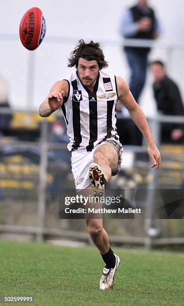 Luke Rounds of Collingwood kicks during the round 11 VFL match between Collingwood and North Ballarat at Victoria Park on July 3, 2010 in Melbourne,...