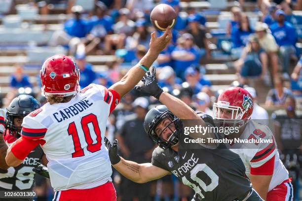 Kyle Johnson of the Air Force Falcons reaches to block Joe Carbone of the Stony Brook Seawolves at Falcon Stadium on September 1, 2018 in Colorado...