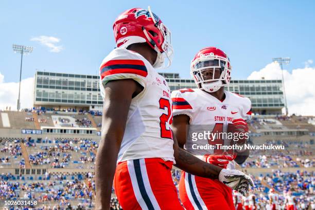 Elijah Duff of the Stony Brook Seawolves speaks with Damarcus Miller at Falcon Stadium on September 1, 2018 in Colorado Springs, Colorado.