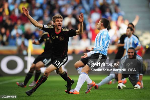 Thomas Mueller of Germany celebrates scoring the opening goal during the 2010 FIFA World Cup South Africa Quarter Final match between Argentina and...