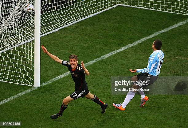 Thomas Mueller of Germany celebrates scoring the opening goal during the 2010 FIFA World Cup South Africa Quarter Final match between Argentina and...