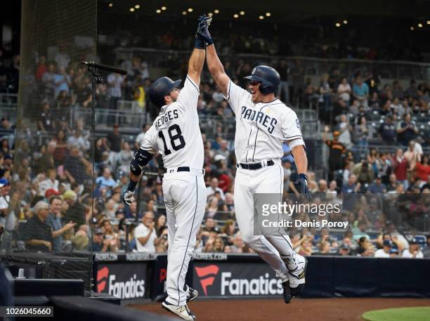 Hunter Renfroe of the San Diego Padres, right, is congratulated by Austin Hedges after hitting a solo home run during the fourth inning of a baseball...