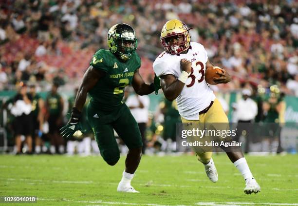 Brelynd Cyphers of the Elon Phoenix rushes for a first down in the fourth quarter of a football game against the South Florida Bulls on September 1,...