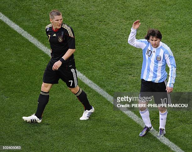 Argentina's striker Lionel Messi gestures next to Germany's midfielder Bastian Schweinsteiger during the 2010 World Cup quarter final Argentina vs...