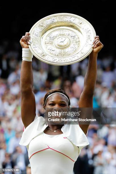 Serena Williams of USA lifts the Championship trophy after winning her Ladies Singles Final Match against Vera Zvonareva of Russia on Day Twelve of...