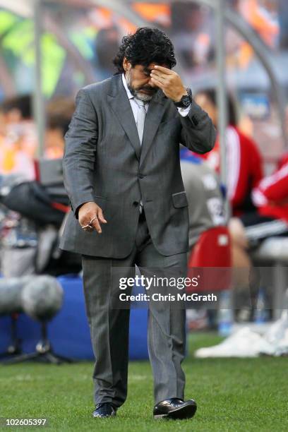 Diego Maradona head coach of Argentina looks thoughtful on the touchline during the 2010 FIFA World Cup South Africa Quarter Final match between...