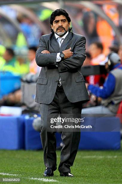 Diego Maradona head coach of Argentina looks thoughtful on the touchline during the 2010 FIFA World Cup South Africa Quarter Final match between...