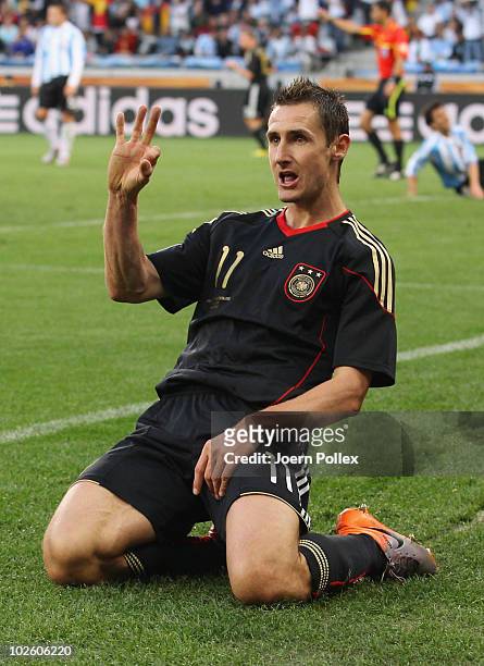 Miroslav Klose of Germany celebrates scoring his team's second goal during the 2010 FIFA World Cup South Africa Quarter Final match between Argentina...