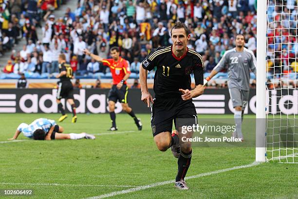 Miroslav Klose of Germany celebrates scoring his team's second goal during the 2010 FIFA World Cup South Africa Quarter Final match between Argentina...