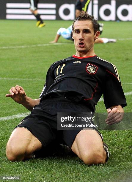 Miroslav Klose of Germany celebrates scoring his team's second goal during the 2010 FIFA World Cup South Africa Quarter Final match between Argentina...