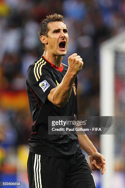 Miroslav Klose of Germany celebrates after scoring their fourth goal during the 2010 FIFA World Cup South Africa Quarter Final match between...