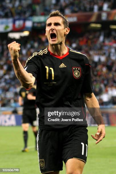 Miroslav Klose of Germany celebrates scoring his team's fourth goal during the 2010 FIFA World Cup South Africa Quarter Final match between Argentina...