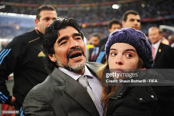 Diego Maradona head coach of Argentina is comforted by his daughter Dalma after the 2010 FIFA World Cup South Africa Quarter Final match between...