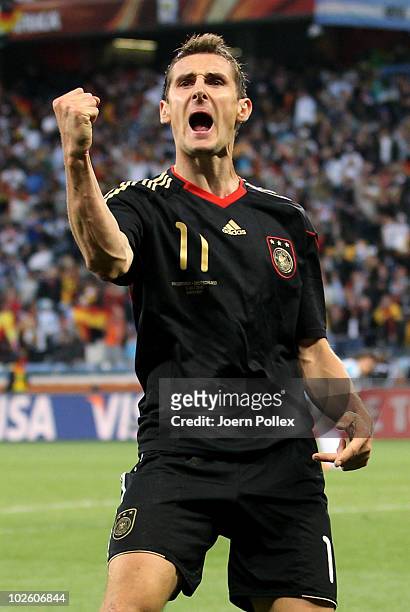 Miroslav Klose of Germany celebrates scoring his team's fourth goal during the 2010 FIFA World Cup South Africa Quarter Final match between Argentina...