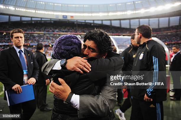 Diego Maradona head coach of Argentina is comforted by his daughter Dalma after the 2010 FIFA World Cup South Africa Quarter Final match between...