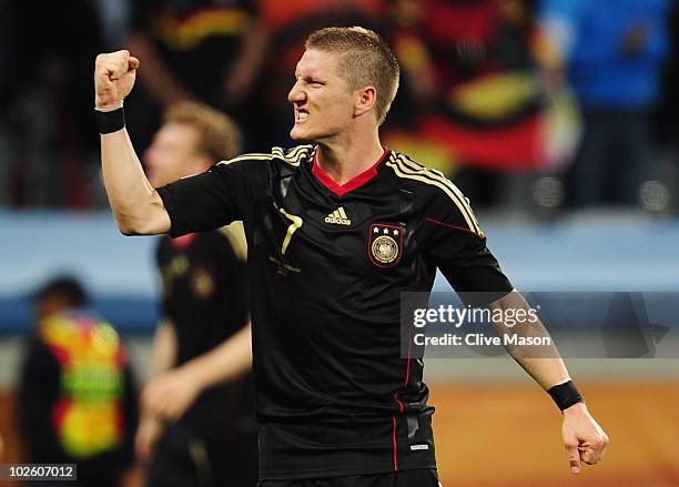 Bastian Schweinsteiger of Germany celebrates after victory and progress to the semi finals during the 2010 FIFA World Cup South Africa Quarter Final...