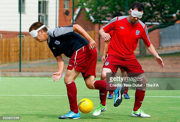 Robin Williams and Jonathan Gribbin of England Blind Squad take part in the training session at Royal National College for the Blind on July 03, 2010...