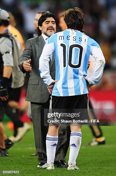 Diego Maradona head coach of Argentina consoles Lionel Messi of Argentina after the 2010 FIFA World Cup South Africa Quarter Final match between...