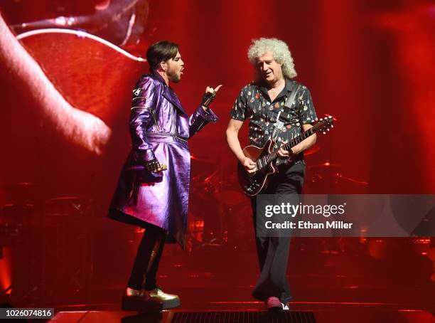 Singer Adam Lambert and guitarist Brian May of Queen + Adam Lambert perform as the group kicks off its 10-date limited engagement, "The Crown...