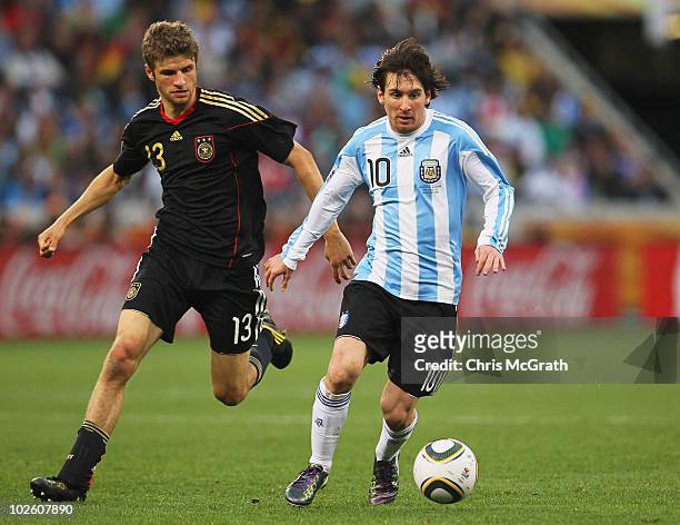 Lionel Messi of Argentina is closed down by Thomas Mueller of Germany during the 2010 FIFA World Cup South Africa Quarter Final match between...