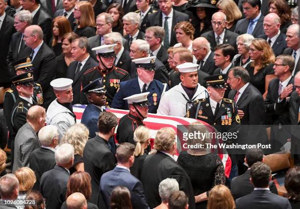 The Honor Guard carries in the casket at the start of the funeral service at the National Cathedral for Sen. John S. McCain , a six-term senator from...