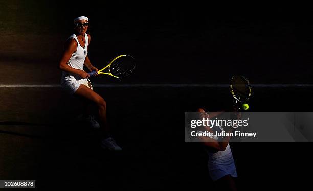 Vania King of the United States and Yaroslava Shvedova of Russia play in the women's doubles final against Elena Vesnina and Vera Zvonareva of Russia...