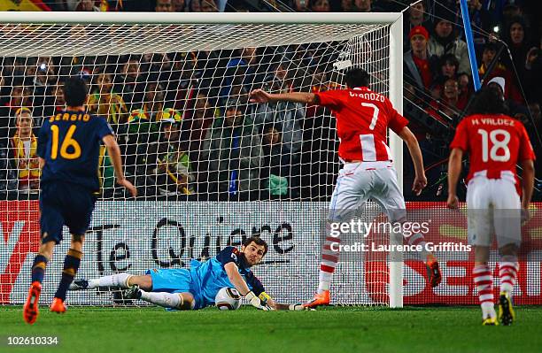 Oscar Cardozo of Paraguay's penalty kick is saved by Iker Casillas of Spain during the 2010 FIFA World Cup South Africa Quarter Final match between...