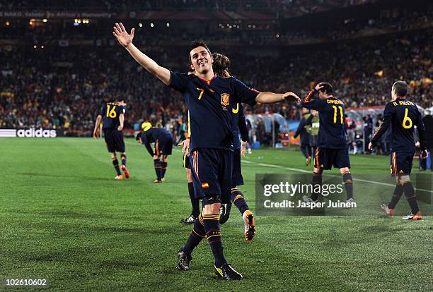 David Villa of Spain celebrates after he scores his side's first goal during the 2010 FIFA World Cup South Africa Quarter Final match between...