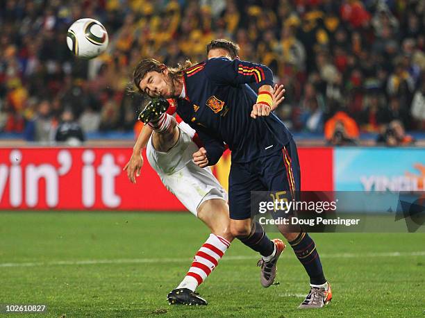 Jonathan Santana of Paraguay kicks Sergio Ramos in the head during the 2010 FIFA World Cup South Africa Quarter Final match between Paraguay and...