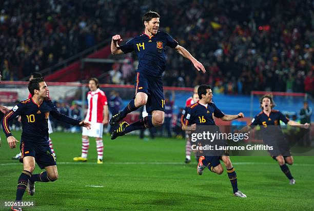 Xabi Alonso of Spain's celebrations are cut short as his penalty has to be taken again after Spain players ran into the area during the 2010 FIFA...