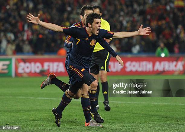 David Villa of Spain celebrates after he scores his side's first goal with team mate Francesc Fabregas during the 2010 FIFA World Cup South Africa...
