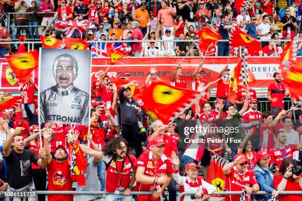 Ferrari fans hold up a banner featuring Lewis Hamilton of Mercedes and Great Britain during the Formula One Grand Prix of Italy at Autodromo di Monza...