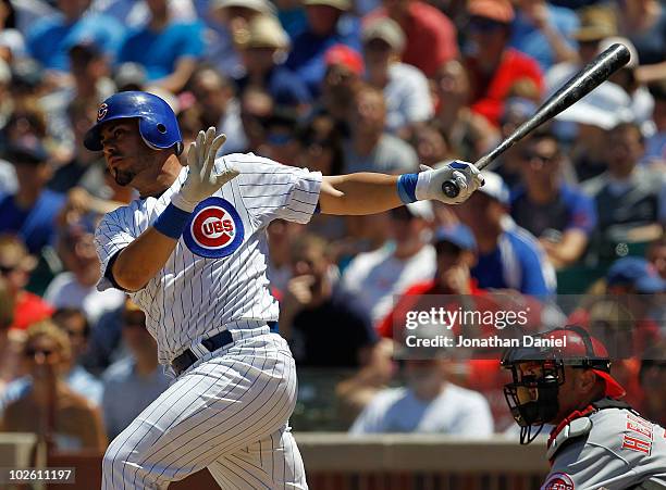 Geovany Soto of the Chicago Cubs hits a run scoring double in the 6th inning against the Cincinnati Reds at Wrigley Field on July 3, 2010 in Chicago,...
