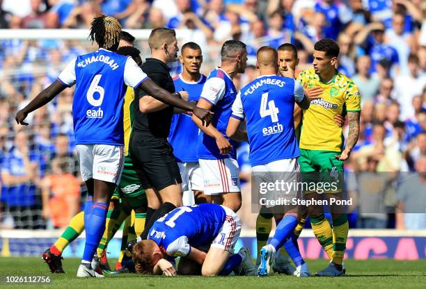 Players clash during the Sky Bet Championship match between Ipswich Town and Norwich City at Portman Road on September 2, 2018 in Ipswich, England.