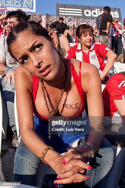 Paraguay fan and model Larissa Riquelme reacts during quarter-final match of the World Cup football match Between Spain and Paraguay on July 3, 2010...