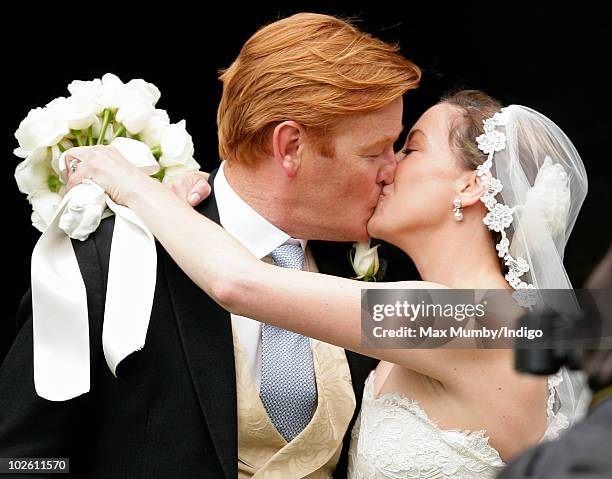 Mark Dyer and Amanda Kline kiss as they leave St. Edmund's Church after their wedding on July 3, 2010 in Abergavenny, Wales.