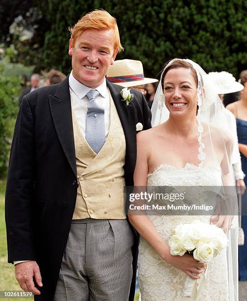 Mark Dyer and Amanda Kline leave St. Edmund's Church after their wedding on July 3, 2010 in Abergavenny, Wales.