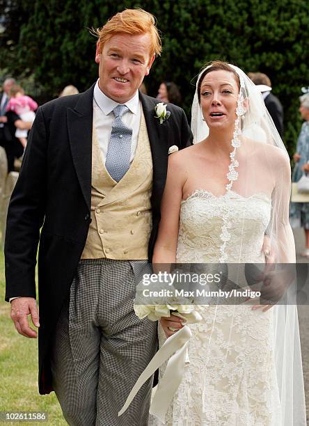 Mark Dyer and Amanda Kline leave St. Edmund's Church after their wedding on July 3, 2010 in Abergavenny, Wales.