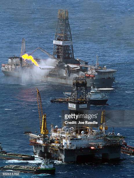 The Transocean Development Driller III and the Discoverer Enterprise drilling rig continue the effort to recover oil and cap the Deepwater Horizon...