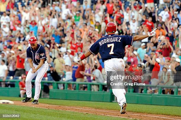 Ivan Rodriguez of the Washington Nationals celebrates after driving in the game winning run in the ninth inning against the New York Mets at...