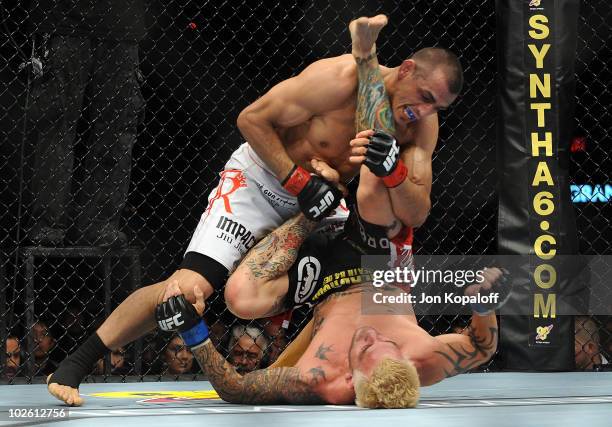 George Sotiropoulos of Australia holds down Kurt Pellegrino during the UFC lightweight bout at the MGM Grand Garden Arena on July 3, 2010 in Las...