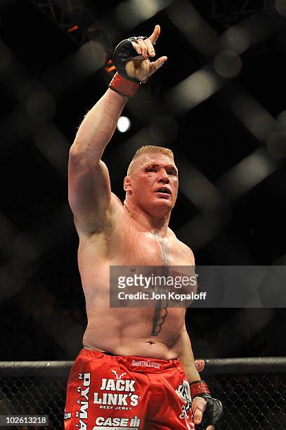 Brock Lesnar reacts after his second round submission of Shane Carwin to win the UFC Heavyweight Championship Unification bout at the MGM Grand...