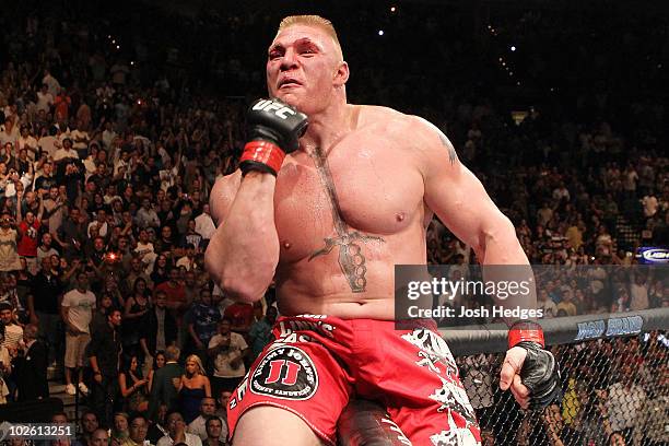 Brock Lesnar reacts after his second round submission victory against Shane Carwin to win the UFC Heavyweight Championship Unification bout at the...