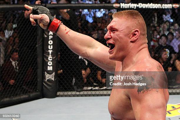 Brock Lesnar reacts after his second round submission victory against Shane Carwin to win the UFC Heavyweight Championship Unification bout at the...
