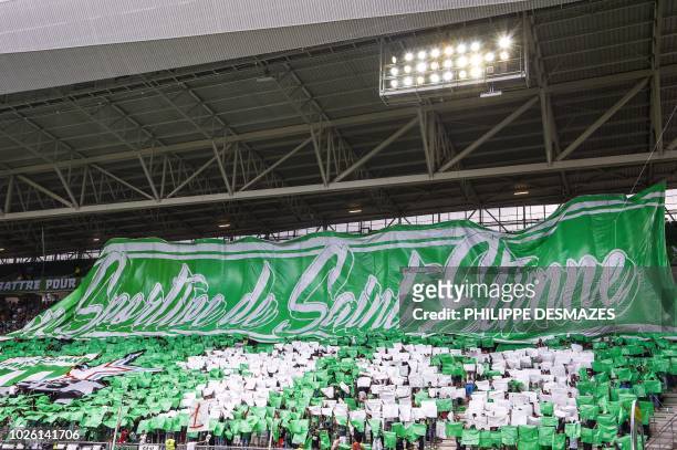 Saint-Etienne's supporters cheer prior to the start of the French L1 football match between AS Saint-Etienne and Amiens SC on September 2 at the...
