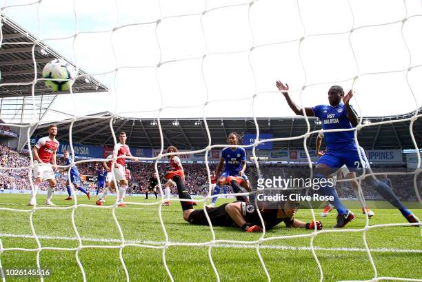 Sol Bamba of Cardiff City celebrates as Danny Ward of Cardiff City scores his team's second goal past Petr Cech of Arsenal during the Premier League...