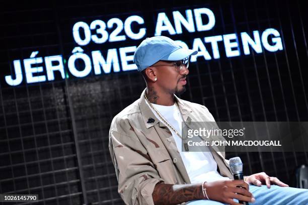 Bayern Munich's German defender Jerome Boateng takes part in a discussion at the Bread and Butter B&B fashion fair on September 2, 2018 in Berlin. -...