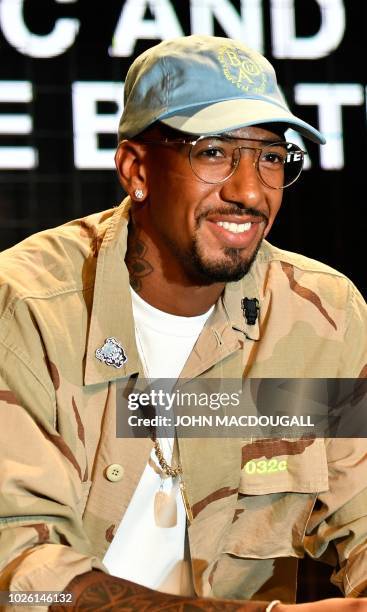 Bayern Munich's German defender Jerome Boateng takes part in a discussion at the Bread and Butter B&B fashion fair on September 2, 2018 in Berlin. -...